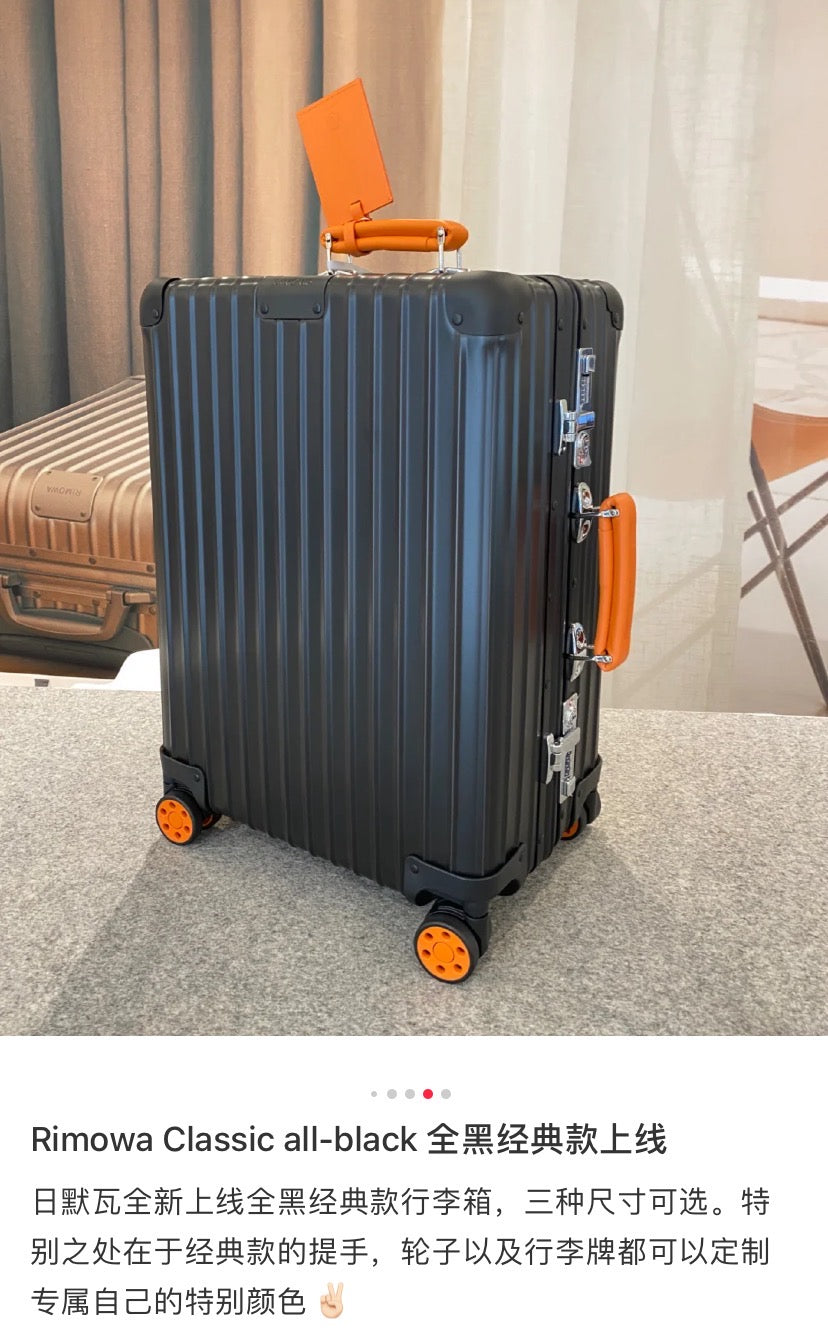 Matte Black Ribbed Hardside Spinner Suitcase with Orange Accents