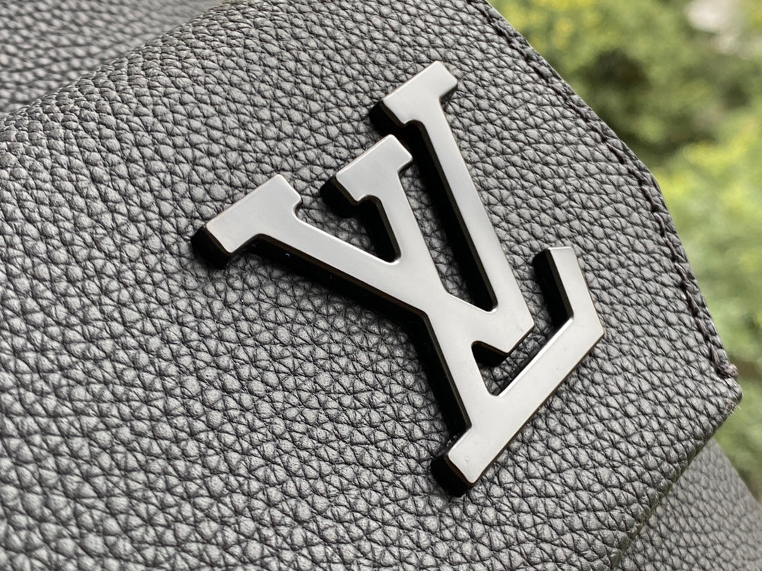 Louis Vuitton Luxury Matte Black Textured Leather Backpack with Pocket