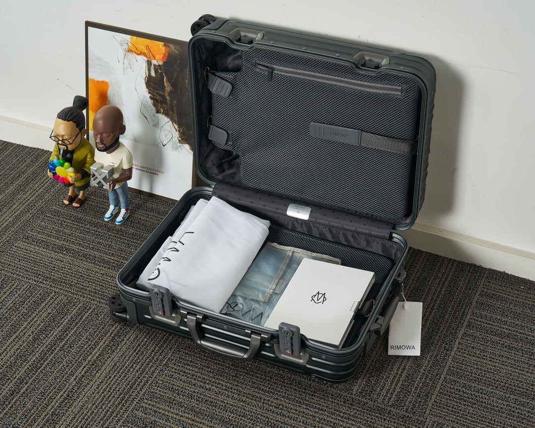Sleek Black Ribbed Hardshell Carry-On Suitcase with Spinner Wheels