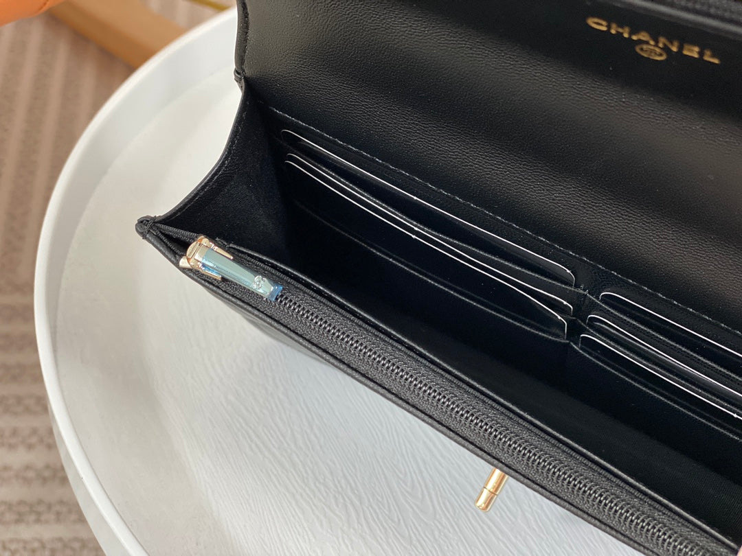 Chanel Black Quilted Leather Flap Bag with Top Handle and Gold Hardware
