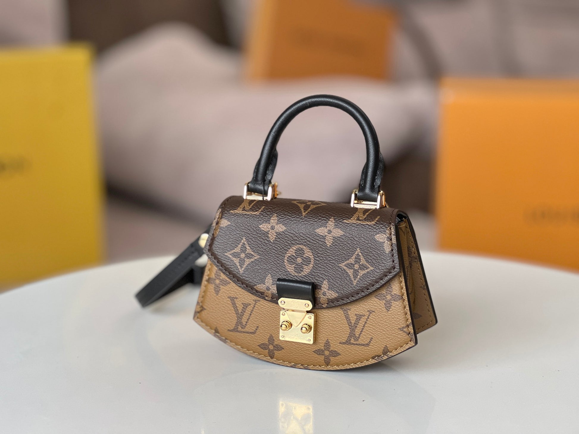 Louis Vuitton Tilcit Handbag Monogram and Monogram Reverse Canvas